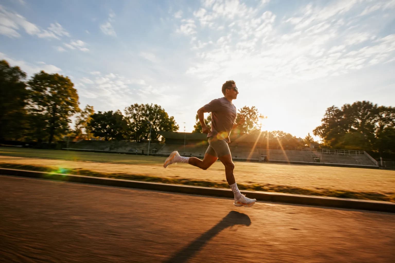 Athlete running at sunrise